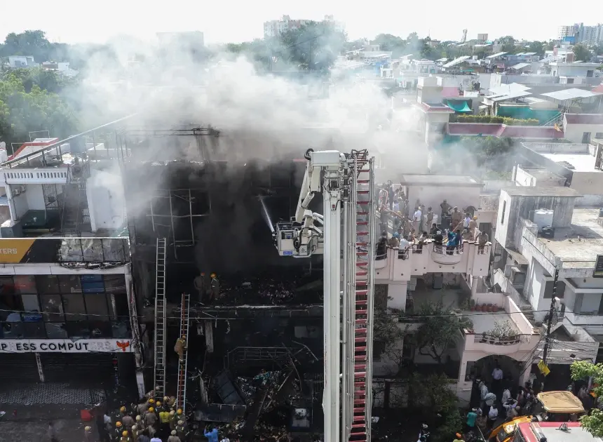 Fire tears through building in northern India, killing 14, mostly students