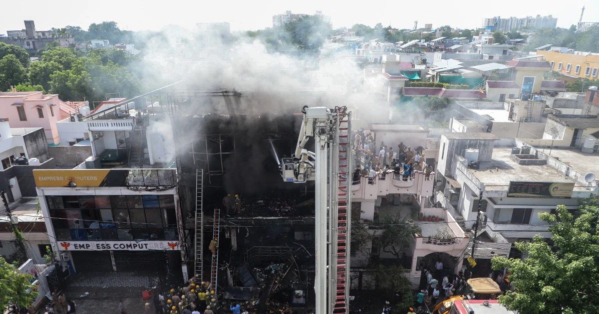 Fire tears through building in northern India, killing 14, mostly students