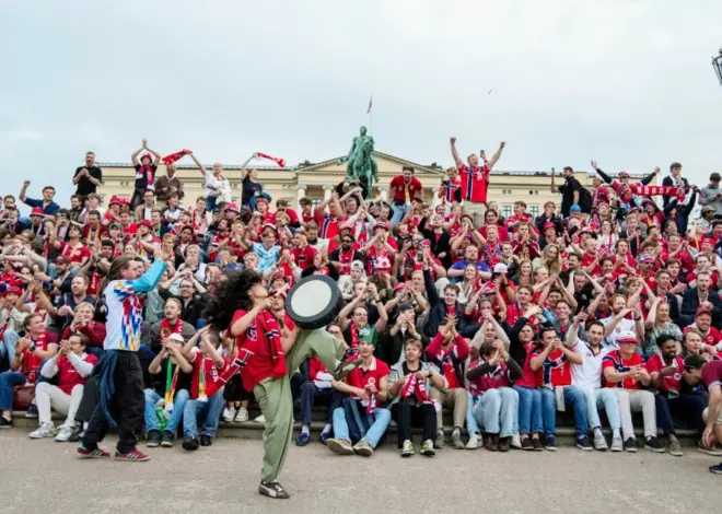 Norwegian fans take dawn World Cup party to palace gates to wake the King