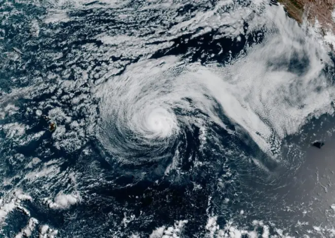 Major Hurricane Genevieve roars in the Pacific as Fausto weakens to a tropical storm near Hawaii