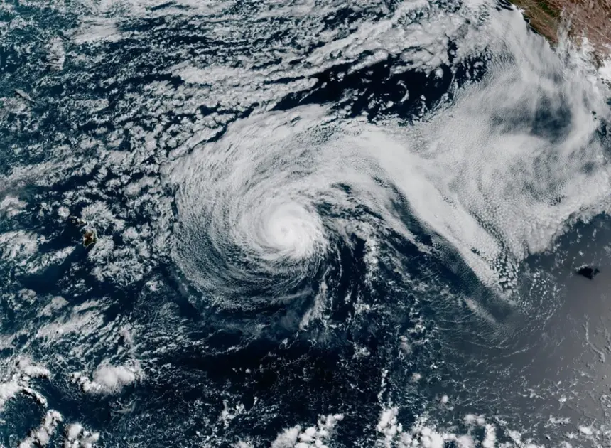 Major Hurricane Genevieve roars in the Pacific as Fausto weakens to a tropical storm near Hawaii