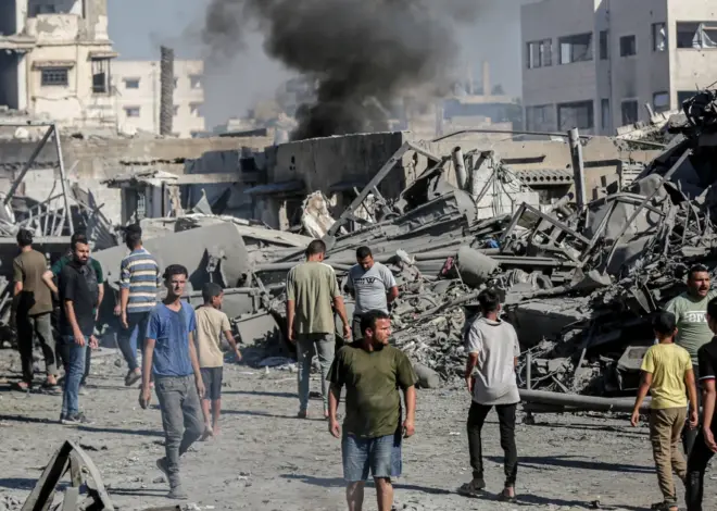 Israel’s latest strikes kill a dozen people in Gaza including police officers