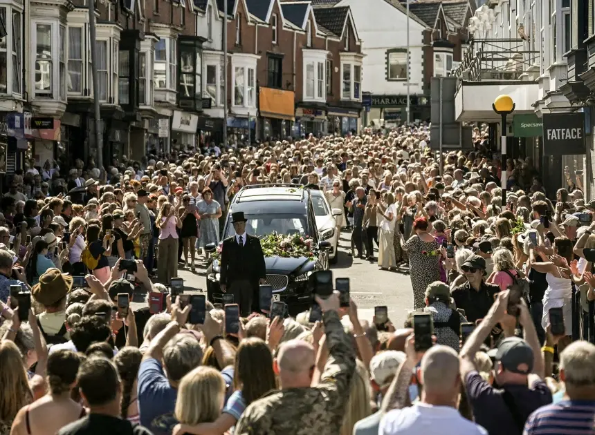 Bonnie Tyler fans line the streets of a Welsh village as her coffin is brought home