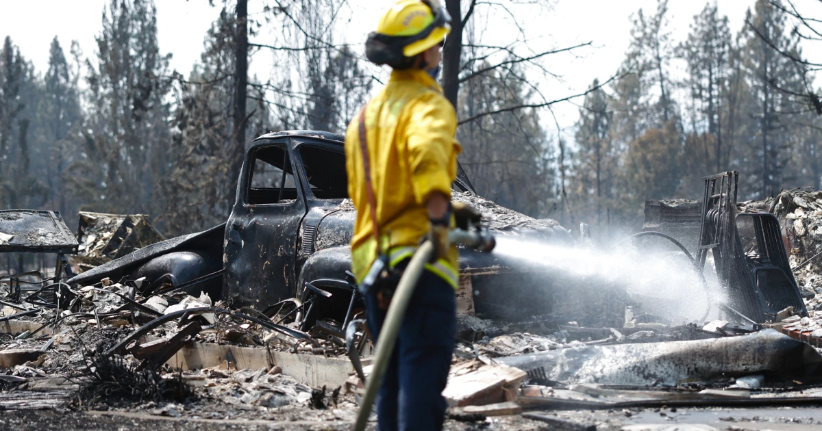 Nearly 100 large wildfires strain firefighting resources across the U.S.