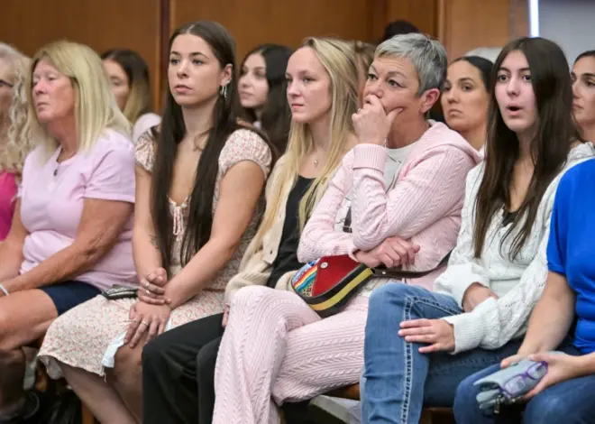 Women in pink rally in support of Lindsay Clancy who is on trial for killing 3 children