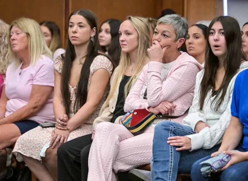 Women in pink rally in support of Lindsay Clancy who is on trial for killing 3 children