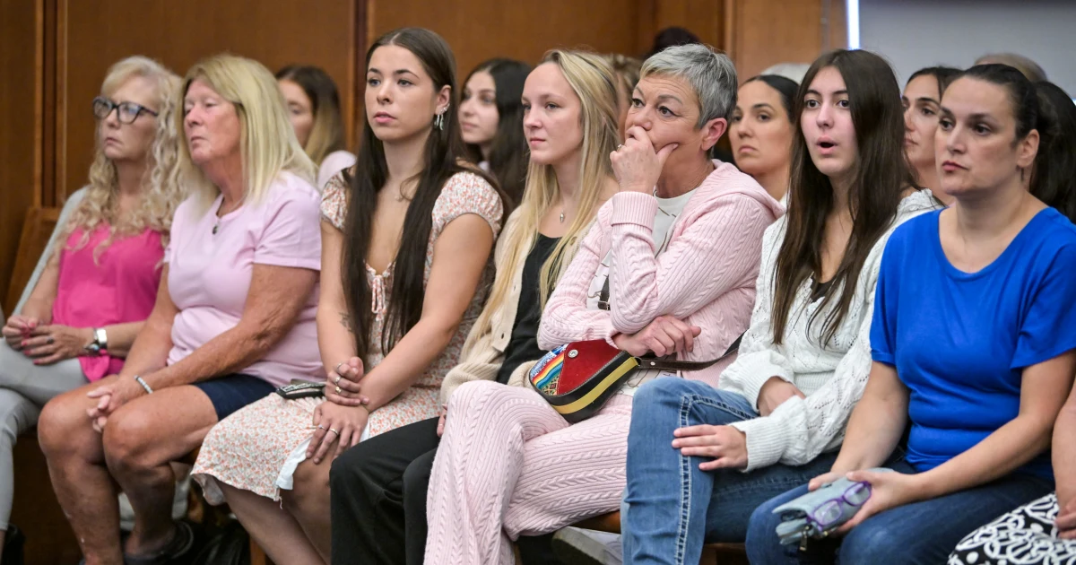 Women in pink rally in support of Lindsay Clancy who is on trial for killing 3 children