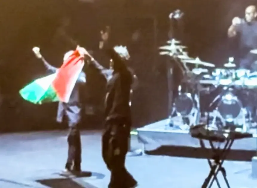 British band Massive Attack says members were detained by Singapore police over Palestinian flag at concert