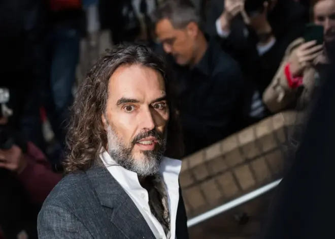 Russell Brand arrives at a London court for his trial on rape and sexual assault charges