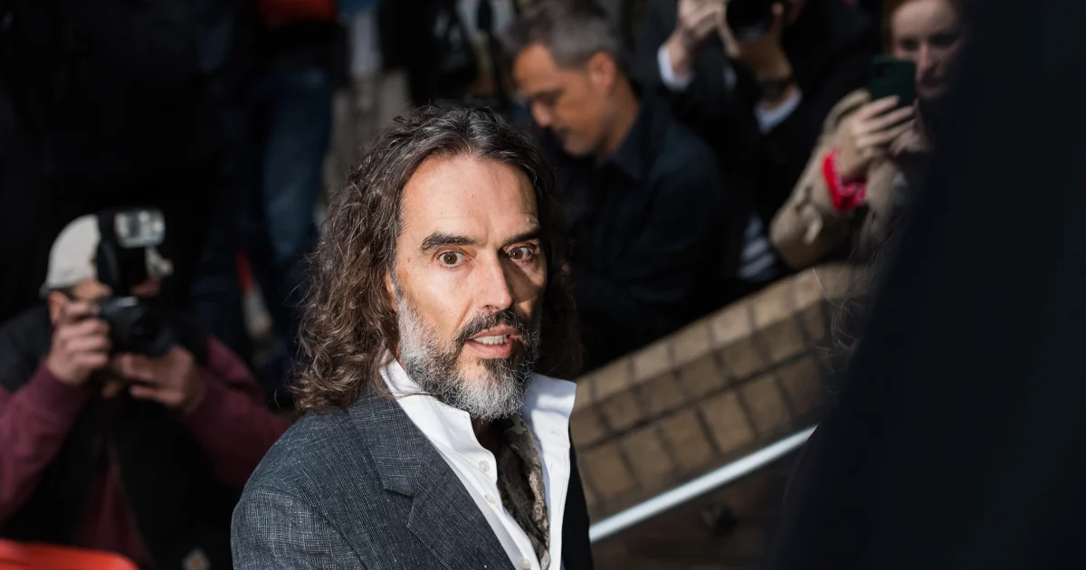 Russell Brand arrives at a London court for his trial on rape and sexual assault charges